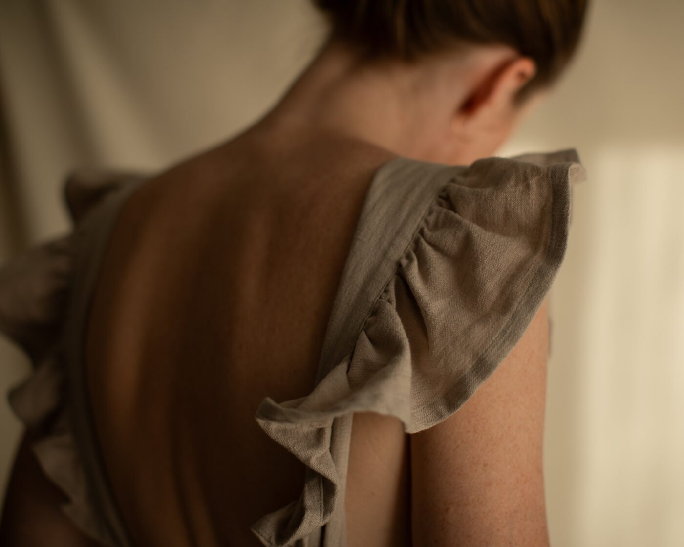 Close-up of neck and shoulder in warm natural light
