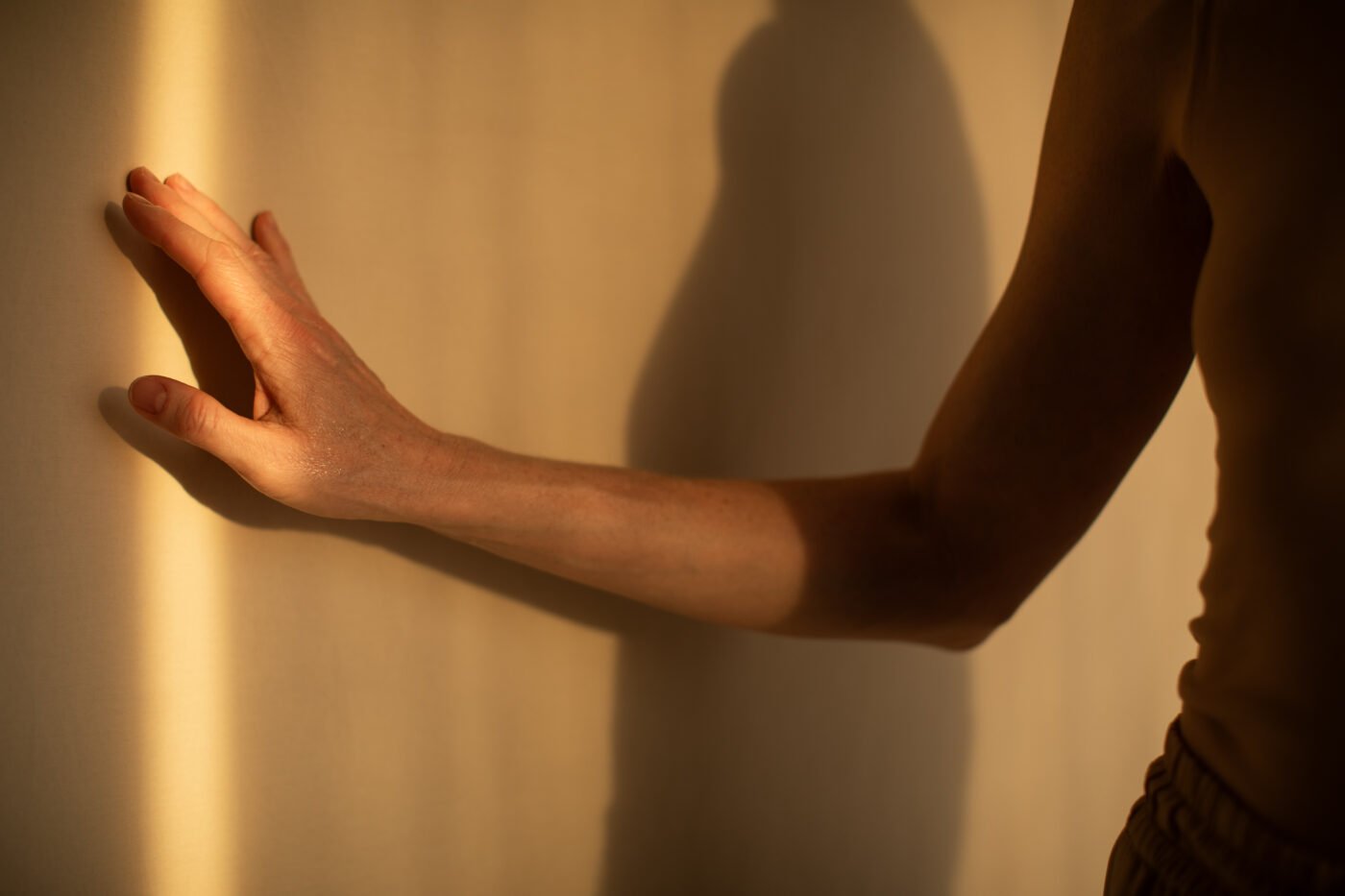 Bare arm and hand in warm afternoon light