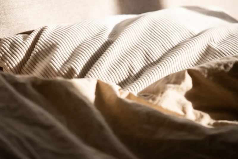 Close-up of a ribbed cushion in warm afternoon light